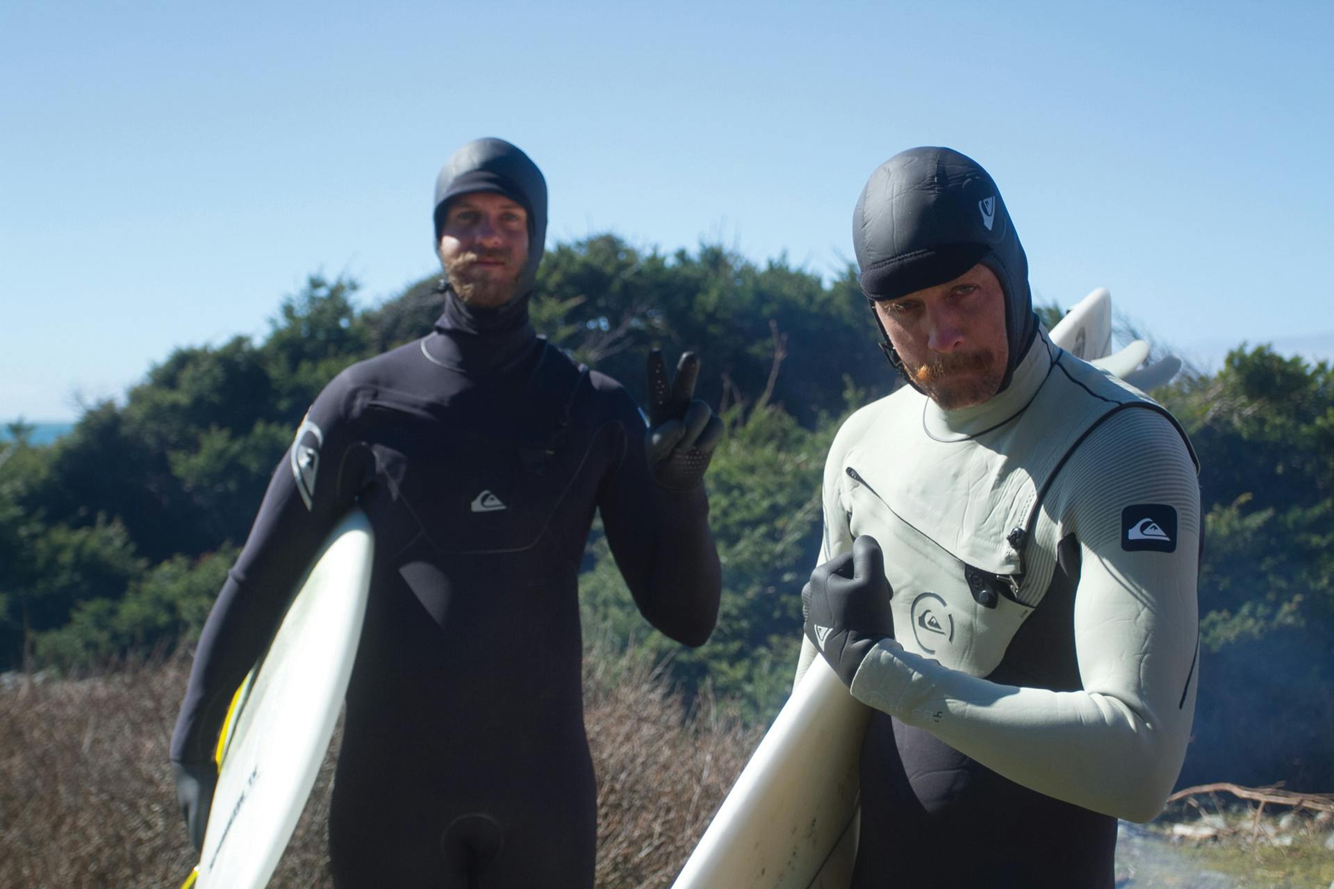 <p>The author, right, and his buddy gear up for some cold winter surf in Northern California. </p>
